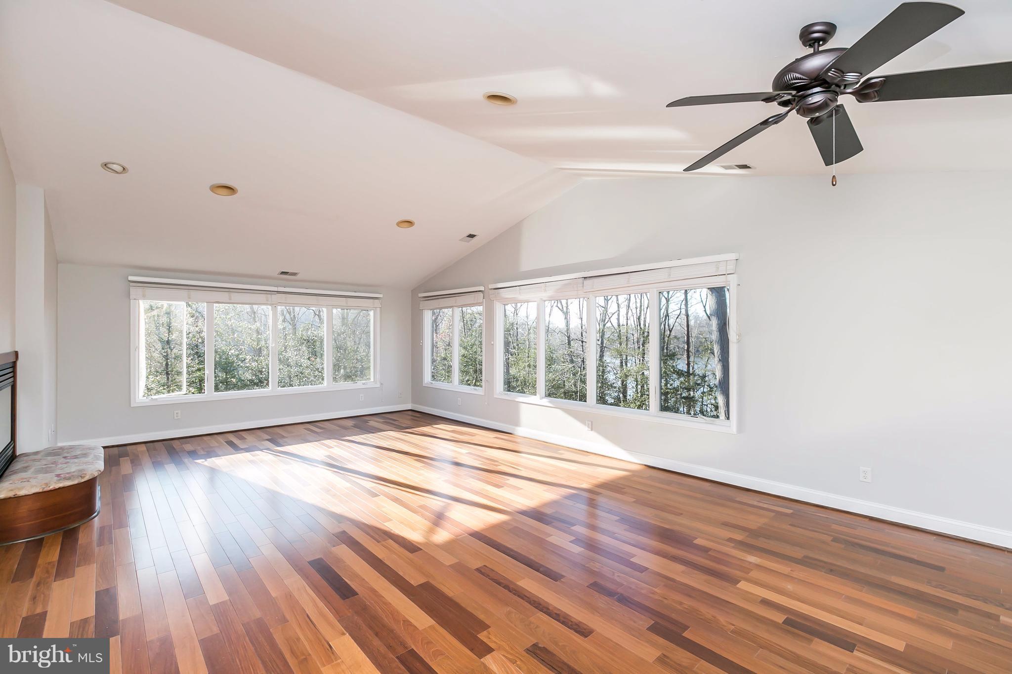 126 Gilbert Court Edgewater, MD 21037 - Photo 13 of 30 a view of an empty room with wooden floor and a window