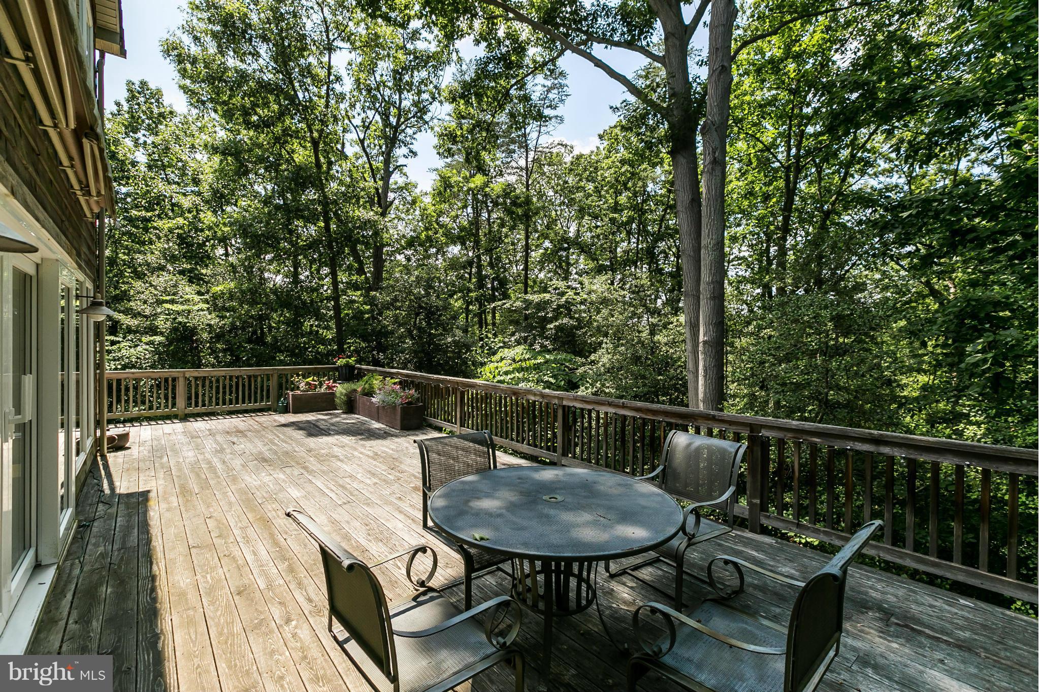 126 Gilbert Court Edgewater, MD 21037 - Photo 21 of 30 a view of a balcony and mountain with wooden floor