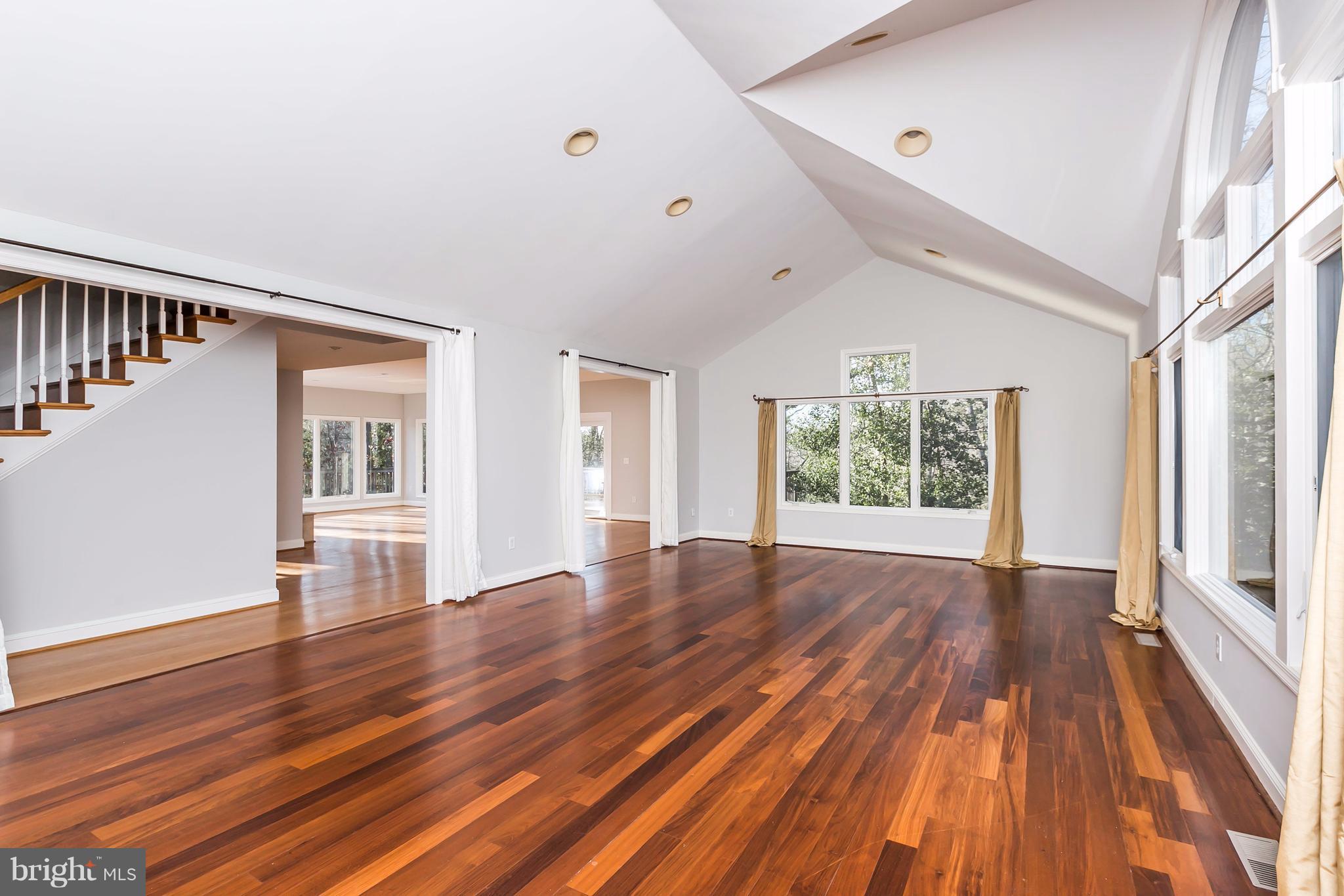 126 Gilbert Court Edgewater, MD 21037 - Photo 4 of 30 a view of an empty room with wooden floor and a window