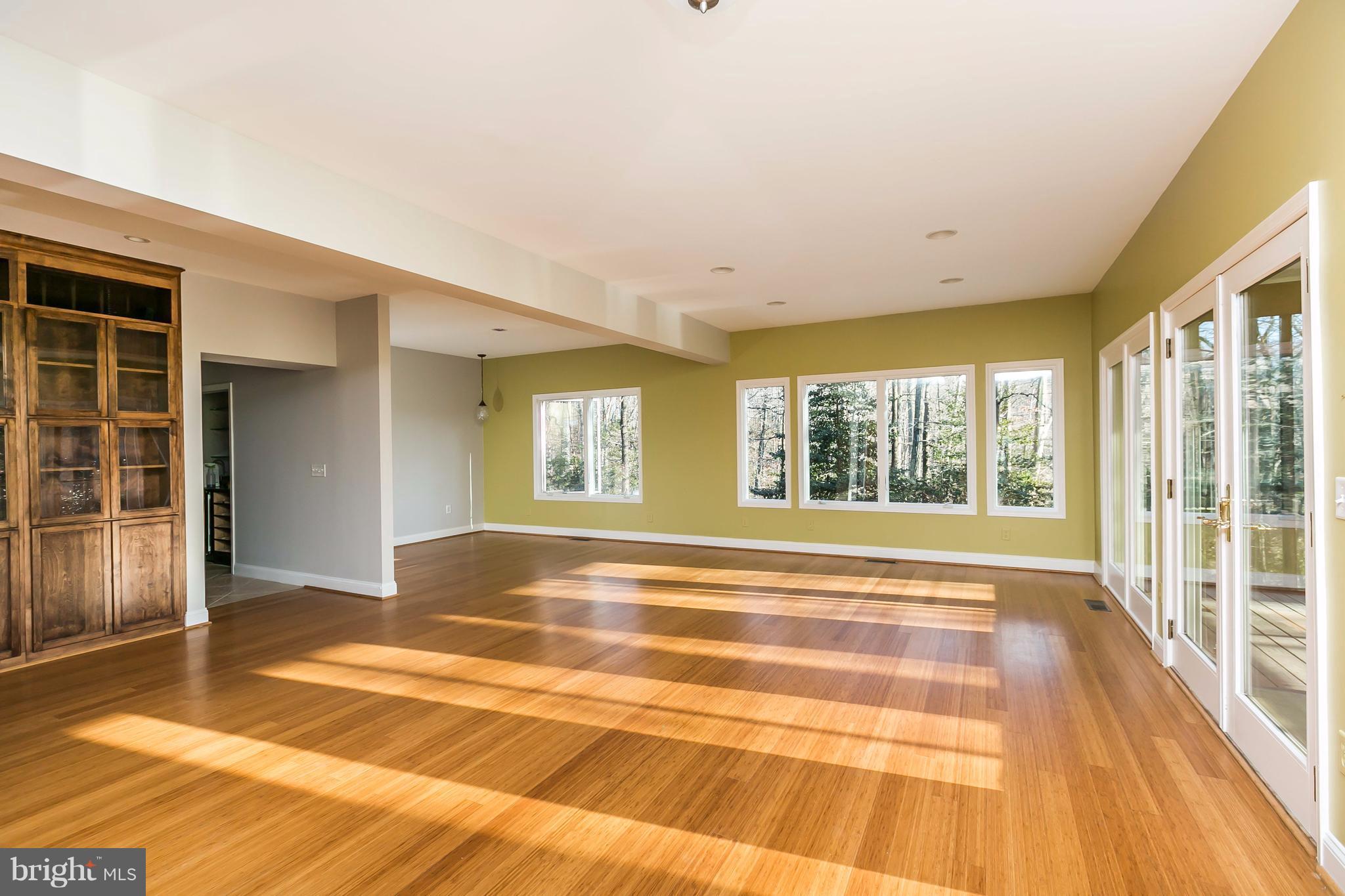 126 Gilbert Court Edgewater, MD 21037 - Photo 10 of 30 a view of an empty room with wooden floor and a window