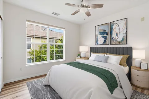 a bedroom with a large bed and a window