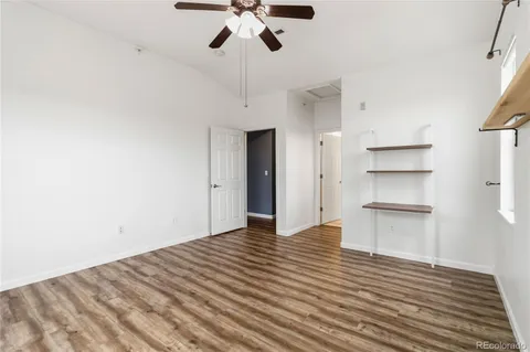 a view of kitchen with wooden floor and electronic appliances