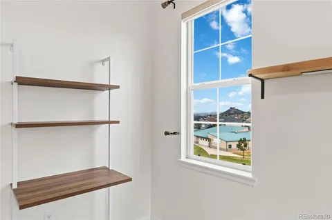 a kitchen with stainless steel appliances granite countertop a refrigerator and a microwave