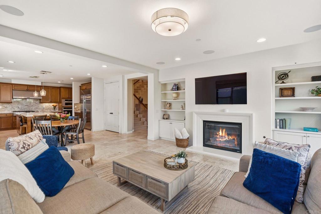 809 Dolphin Circle Encinitas, CA 92024 - Photo 26 of 71 a living room with furniture and a fireplace
