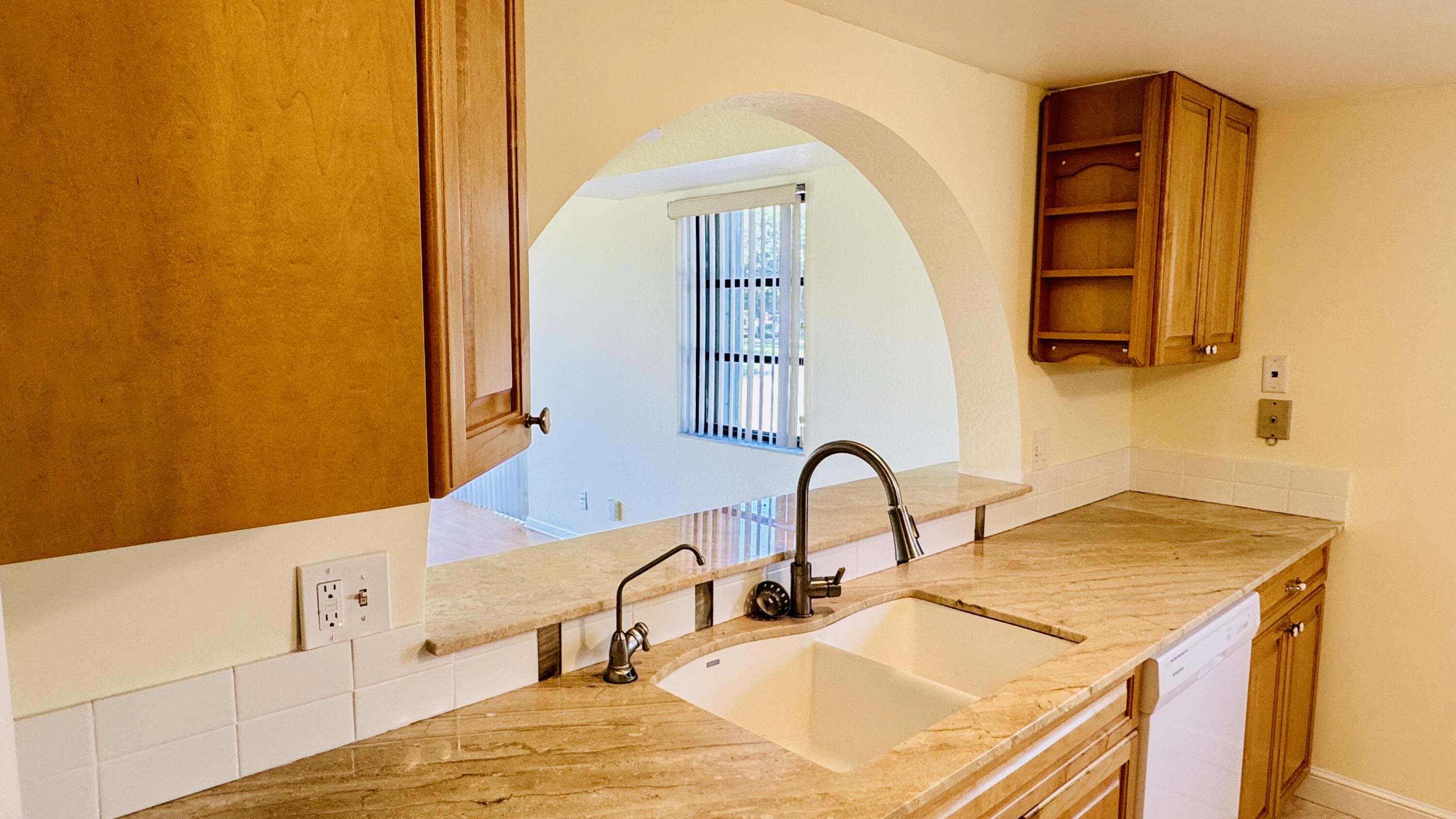 7030 Half Moon Circle, Unit 121 Hypoluxo, FL 33462 - Photo 29 of 74 Updated kitchen