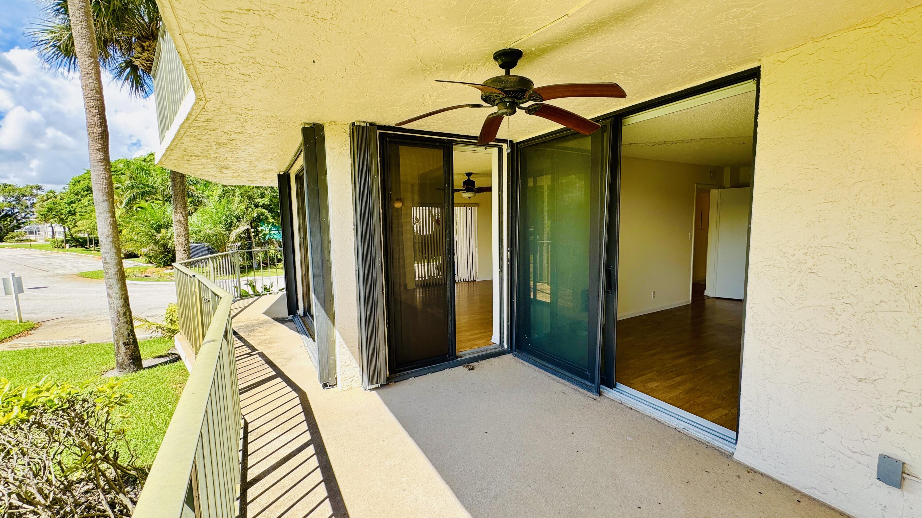 7030 Half Moon Circle, Unit 121 Hypoluxo, FL 33462 - Photo 38 of 74 Pation entrance from master bedroom