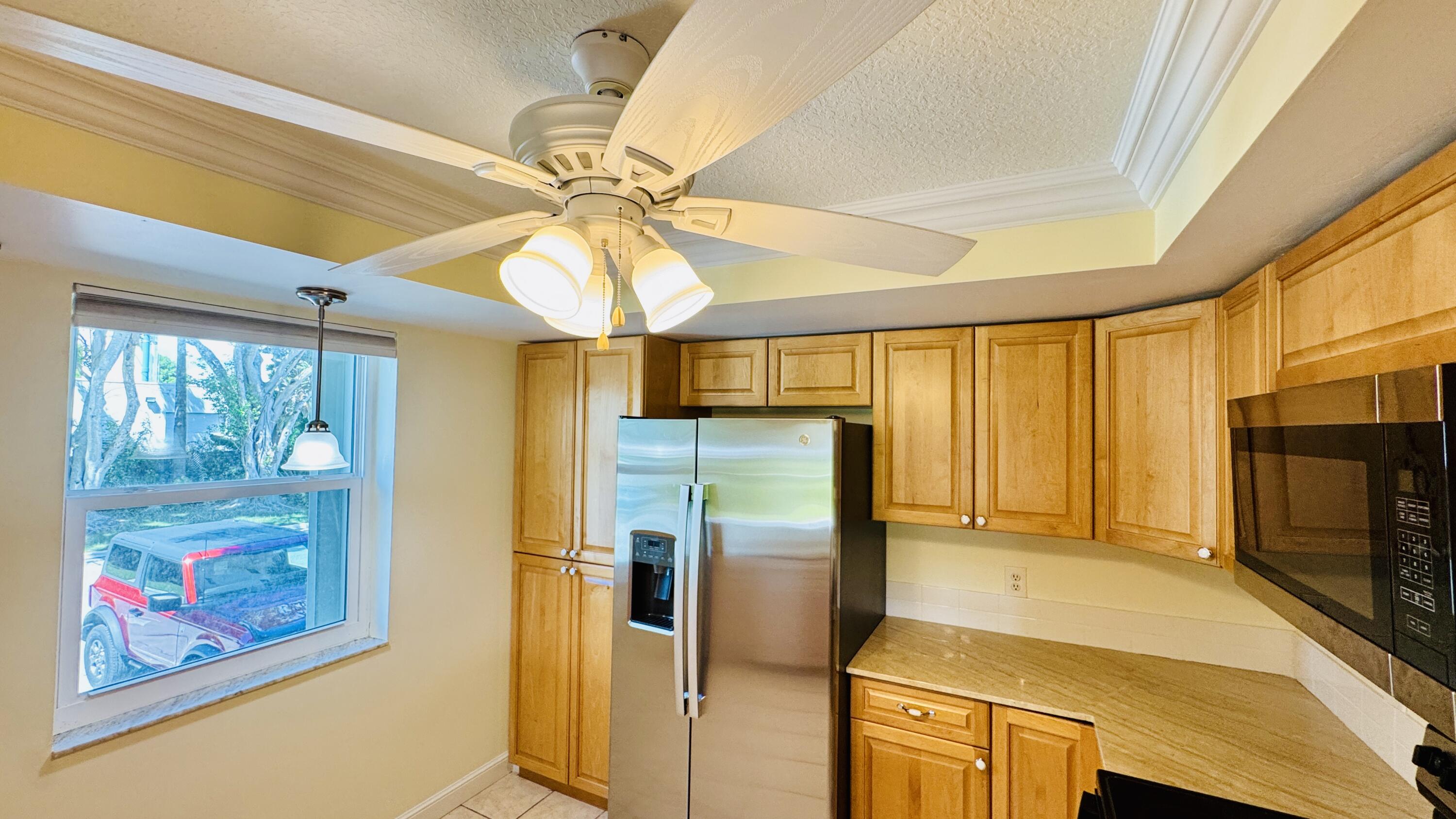 7030 Half Moon Circle, Unit 121 Hypoluxo, FL 33462 - Photo 46 of 74 Kitchen window