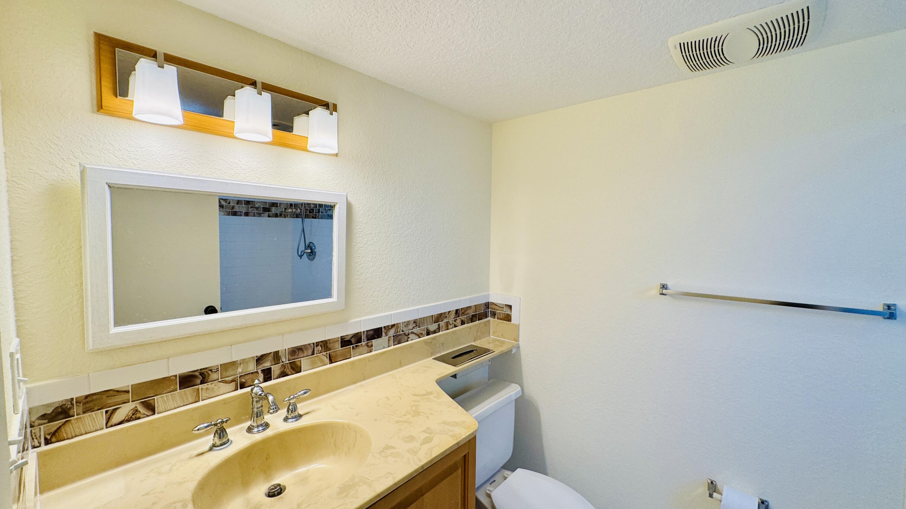 7030 Half Moon Circle, Unit 121 Hypoluxo, FL 33462 - Photo 56 of 74 Second bathroom