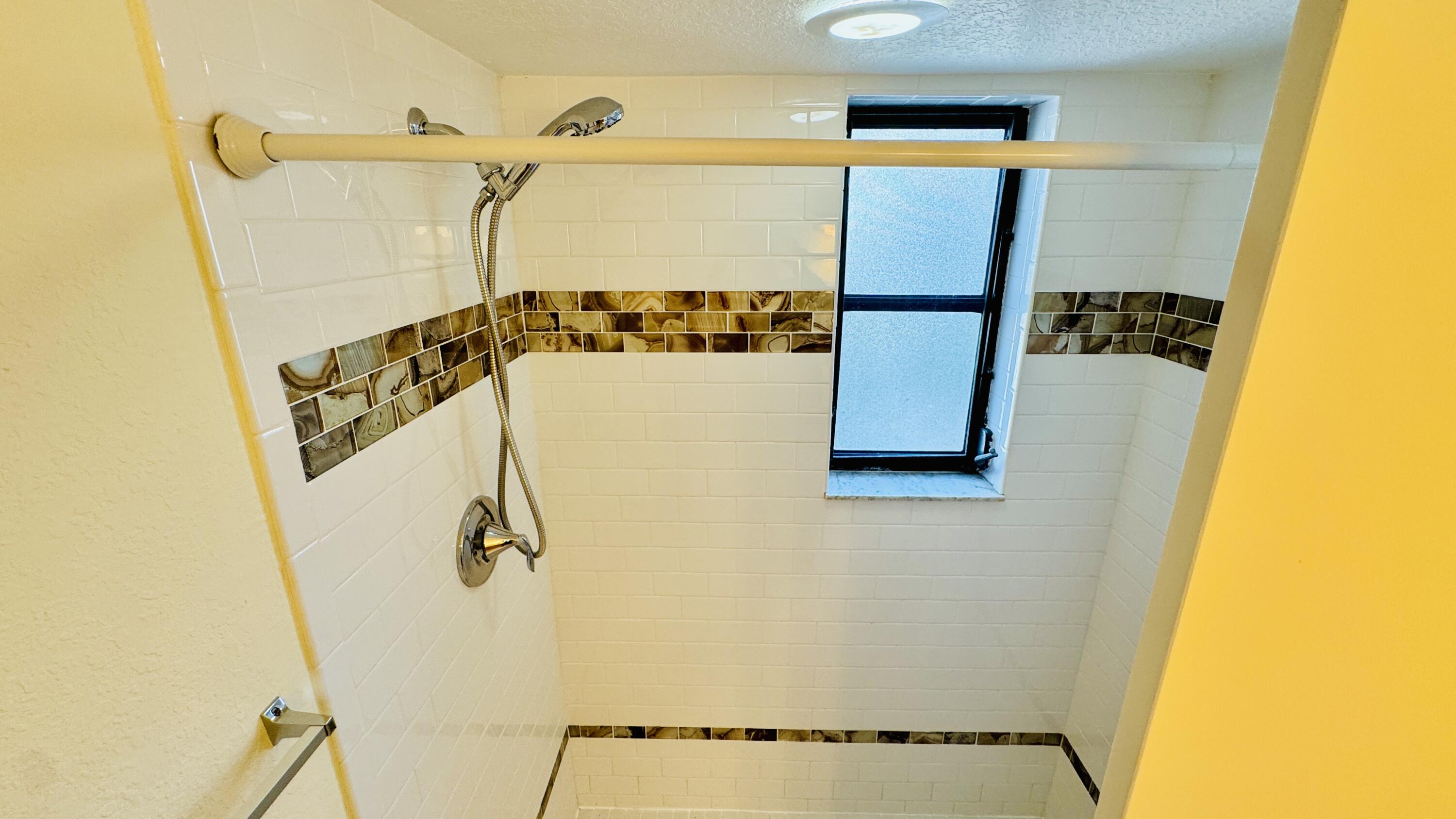7030 Half Moon Circle, Unit 121 Hypoluxo, FL 33462 - Photo 57 of 74 Second bathroom shower