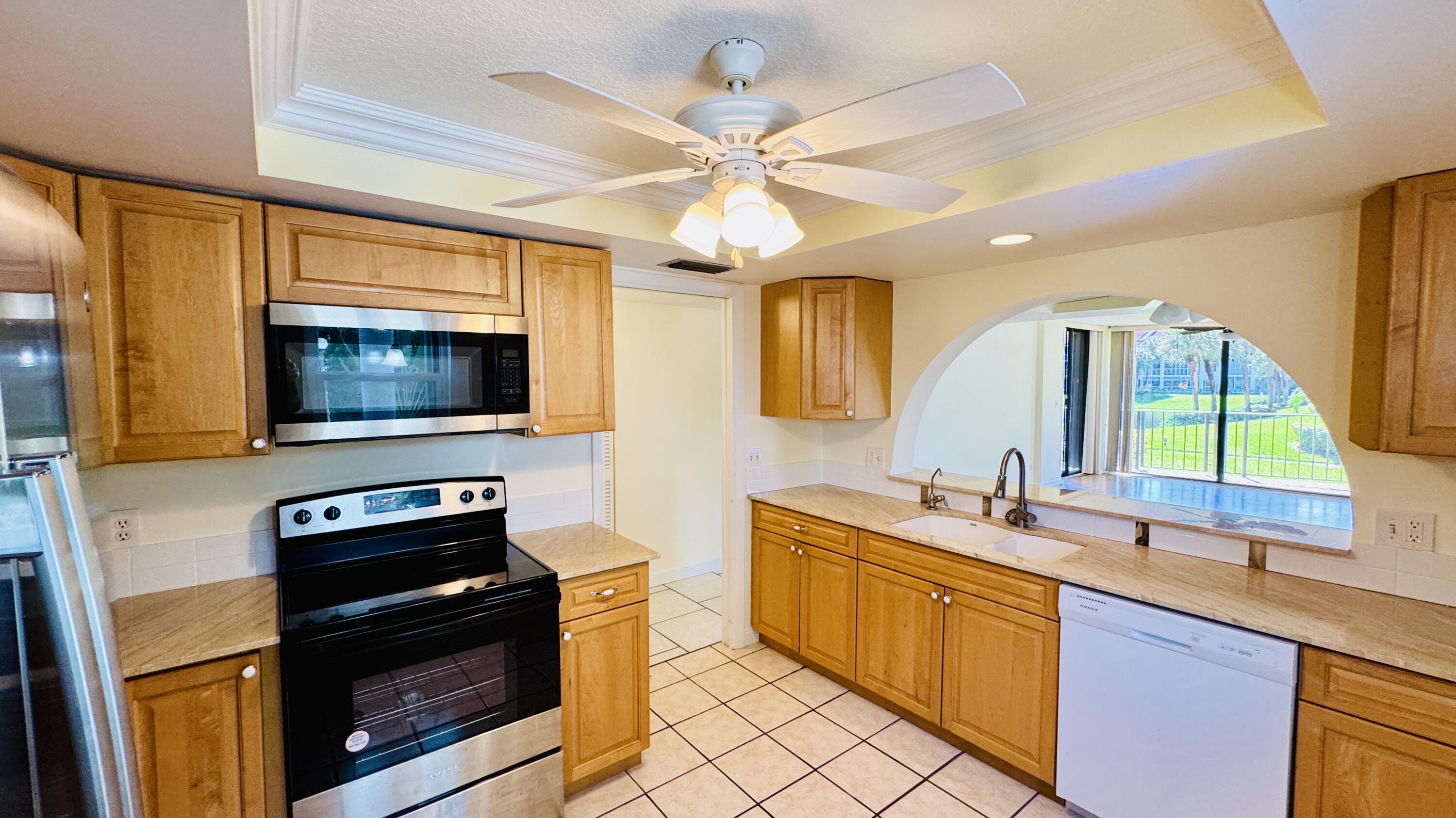7030 Half Moon Circle, Unit 121 Hypoluxo, FL 33462 - Photo 60 of 74 Updated kitchen