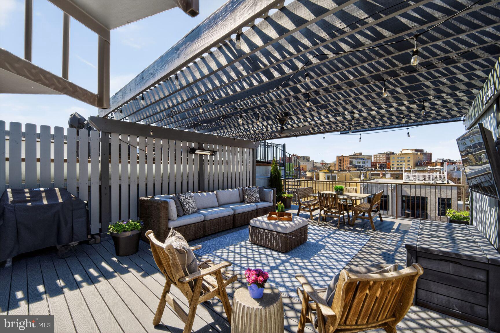 a outdoor living space with patio furniture and a potted plant