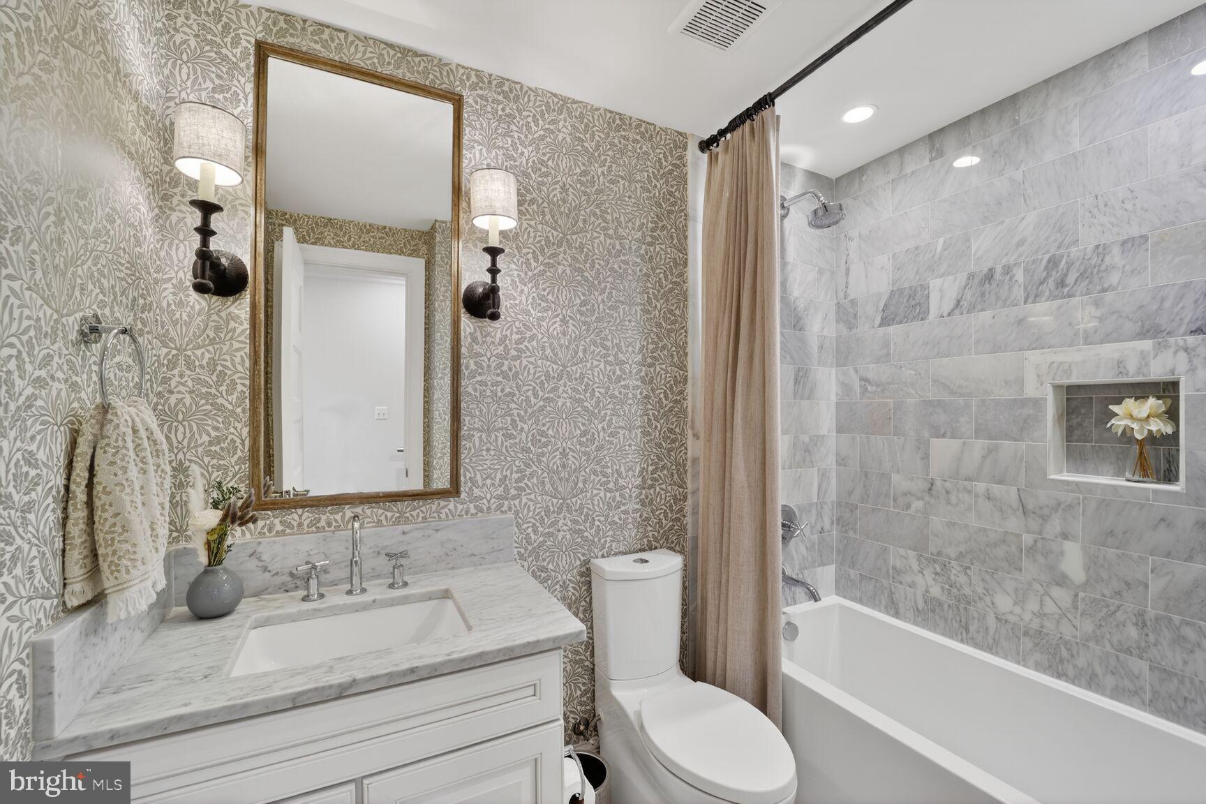 2446 Ontario Road Northwest, Unit 4 Washington, DC 20009 - Photo 12 of 65 a bathroom with a sink toilet and shower