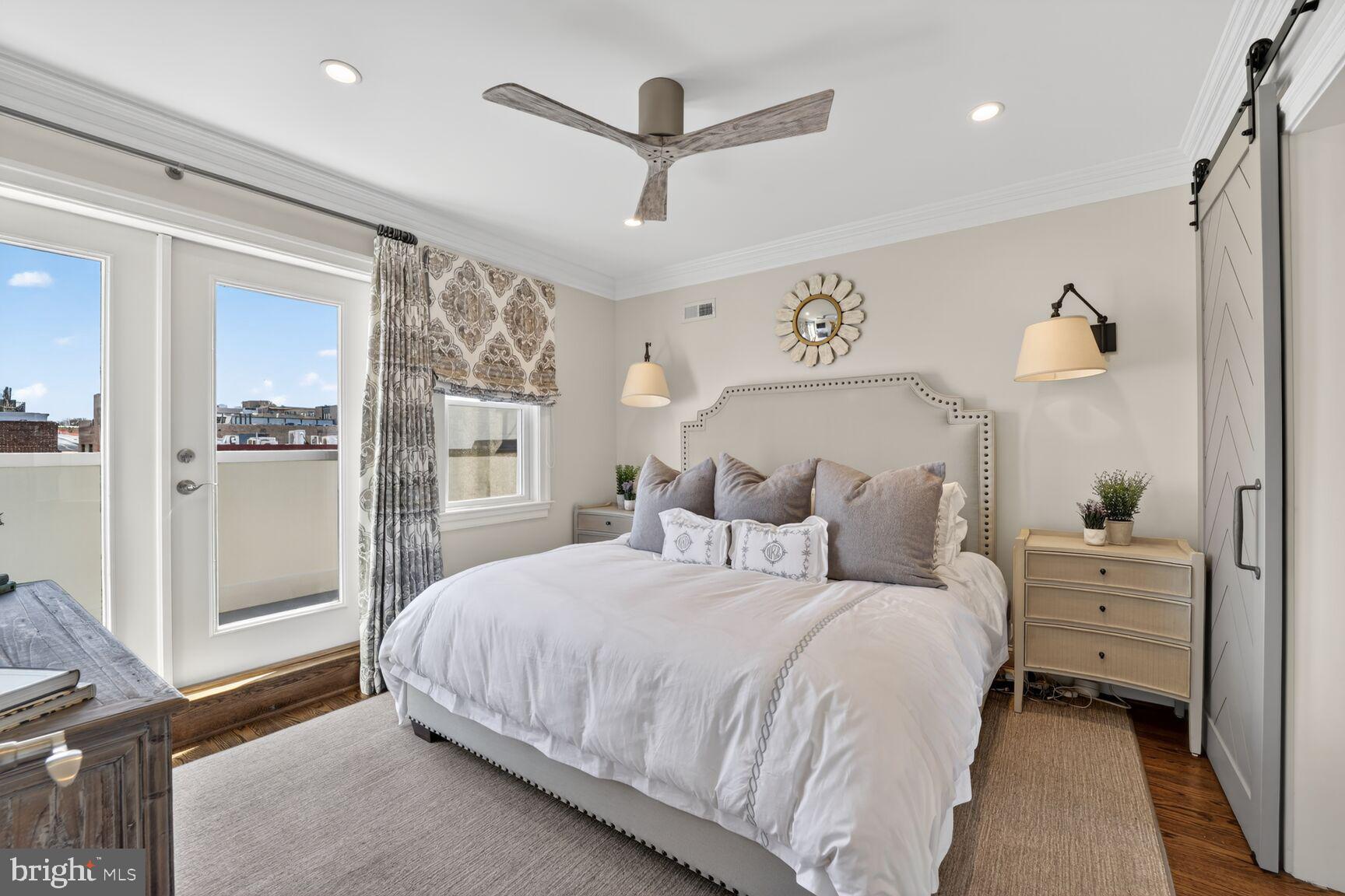 2446 Ontario Road Northwest, Unit 4 Washington, DC 20009 - Photo 24 of 65 a bedroom with a bed and a chandelier