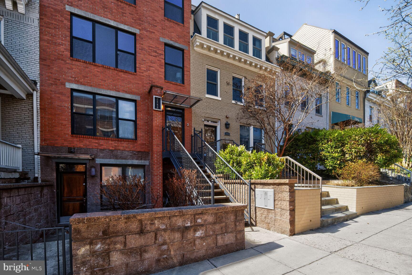 2446 Ontario Road Northwest, Unit 4 Washington, DC 20009 - Photo 46 of 65 a front view of a house with a yard