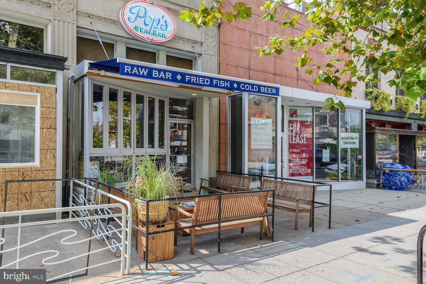 2446 Ontario Road Northwest, Unit 4 Washington, DC 20009 - Photo 54 of 65 a view of a cafe with a couple of people seating on table and chairs