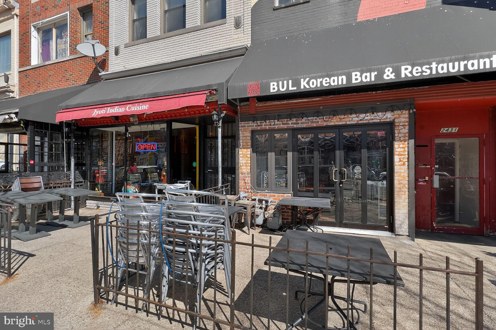 2446 Ontario Road Northwest, Unit 4 Washington, DC 20009 - Photo 58 of 65 a view of a cafe with a table and chairs in patio