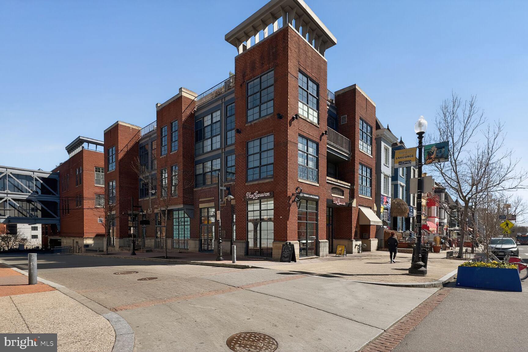 2446 Ontario Road Northwest, Unit 4 Washington, DC 20009 - Photo 60 of 65 a city street lined with buildings and trees