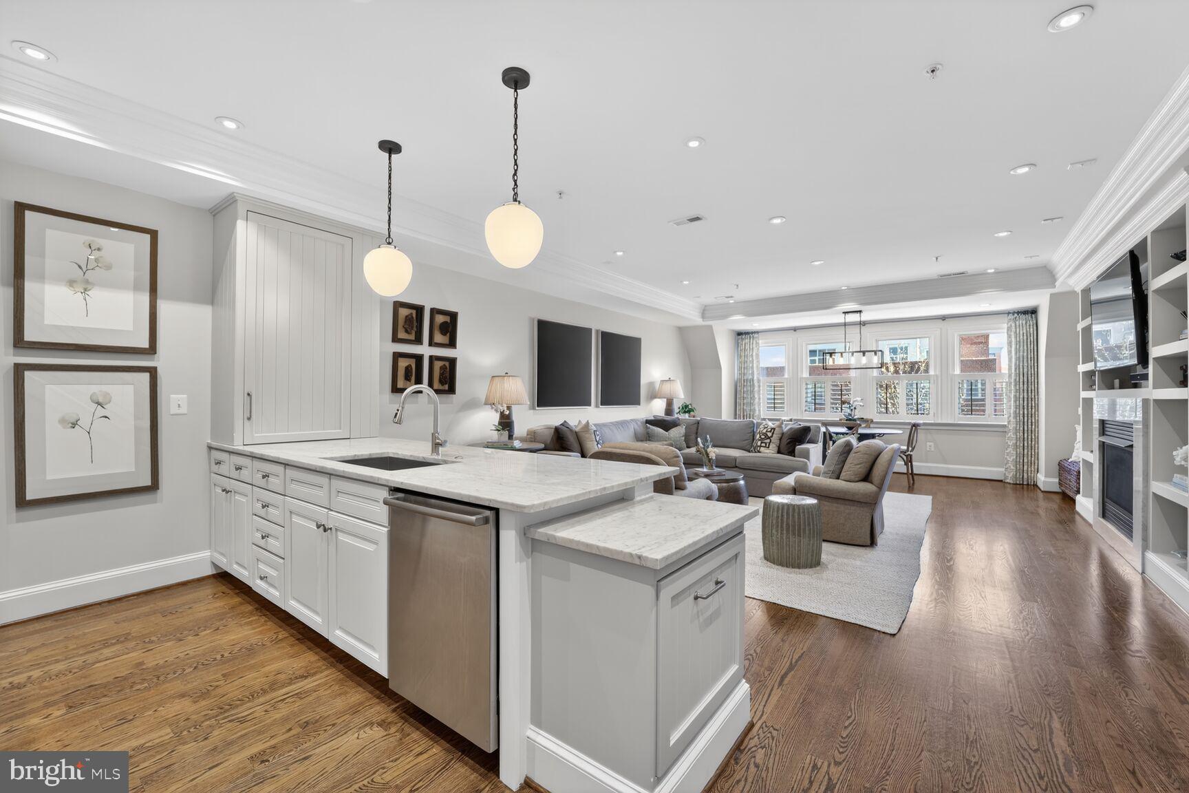 2446 Ontario Road Northwest, Unit 4 Washington, DC 20009 - Photo 6 of 65 a large kitchen with cabinets a sink a counter space and stainless steel appliances