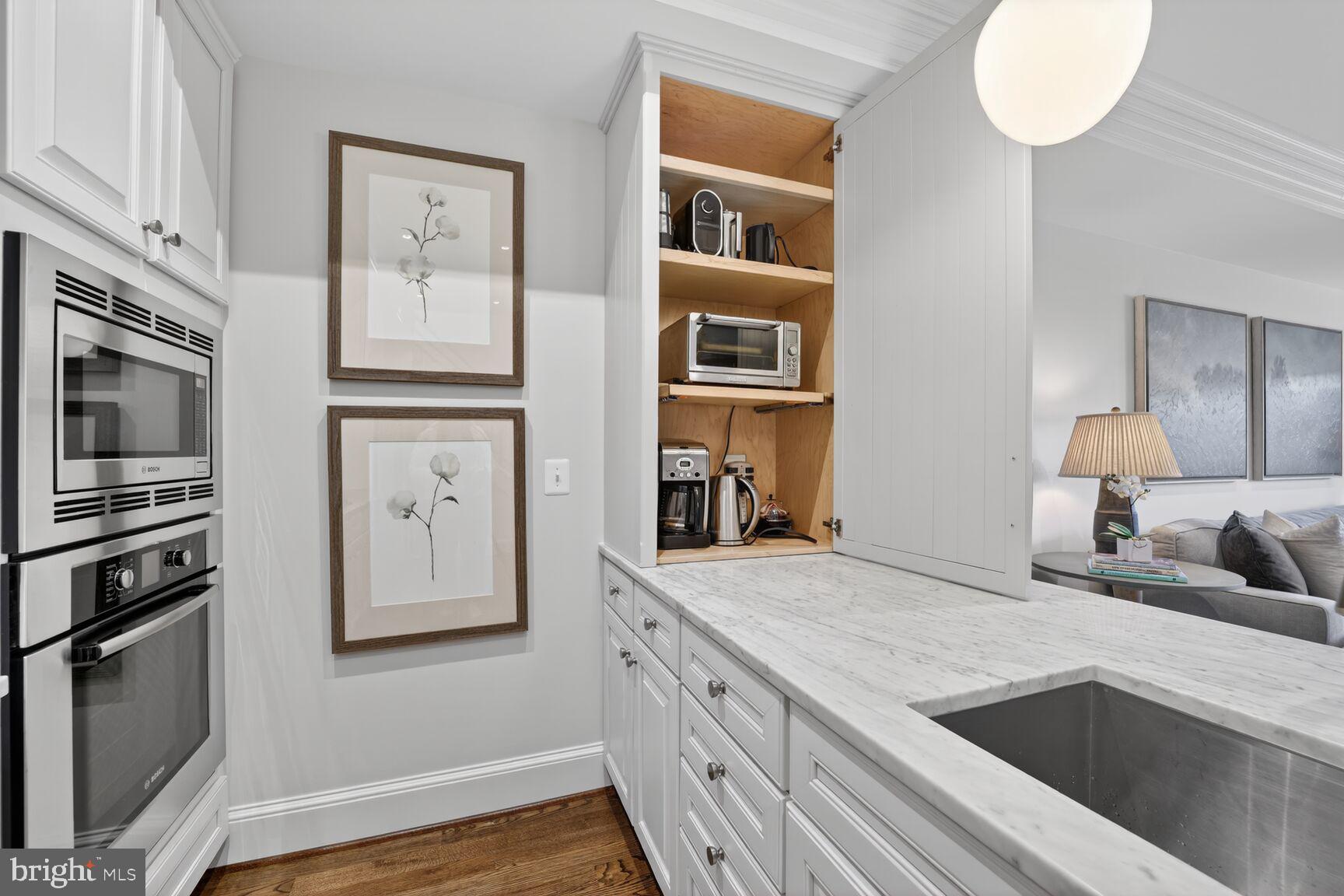 2446 Ontario Road Northwest, Unit 4 Washington, DC 20009 - Photo 8 of 65 a kitchen with stainless steel appliances granite countertop a sink and cabinets
