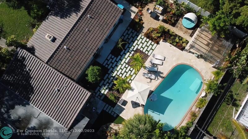 an aerial view of a house swimming pool and outdoor space