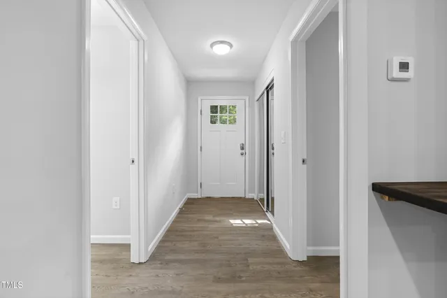 a kitchen with sink stove and cabinets