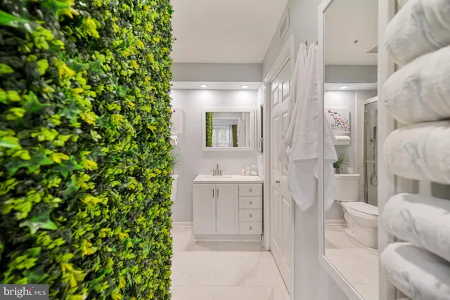 a bathroom with a sink and mirror
