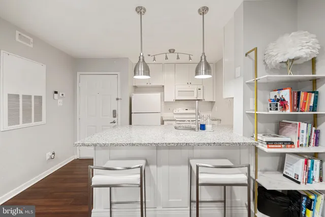 a kitchen with stainless steel appliances granite countertop a sink and a cabinets