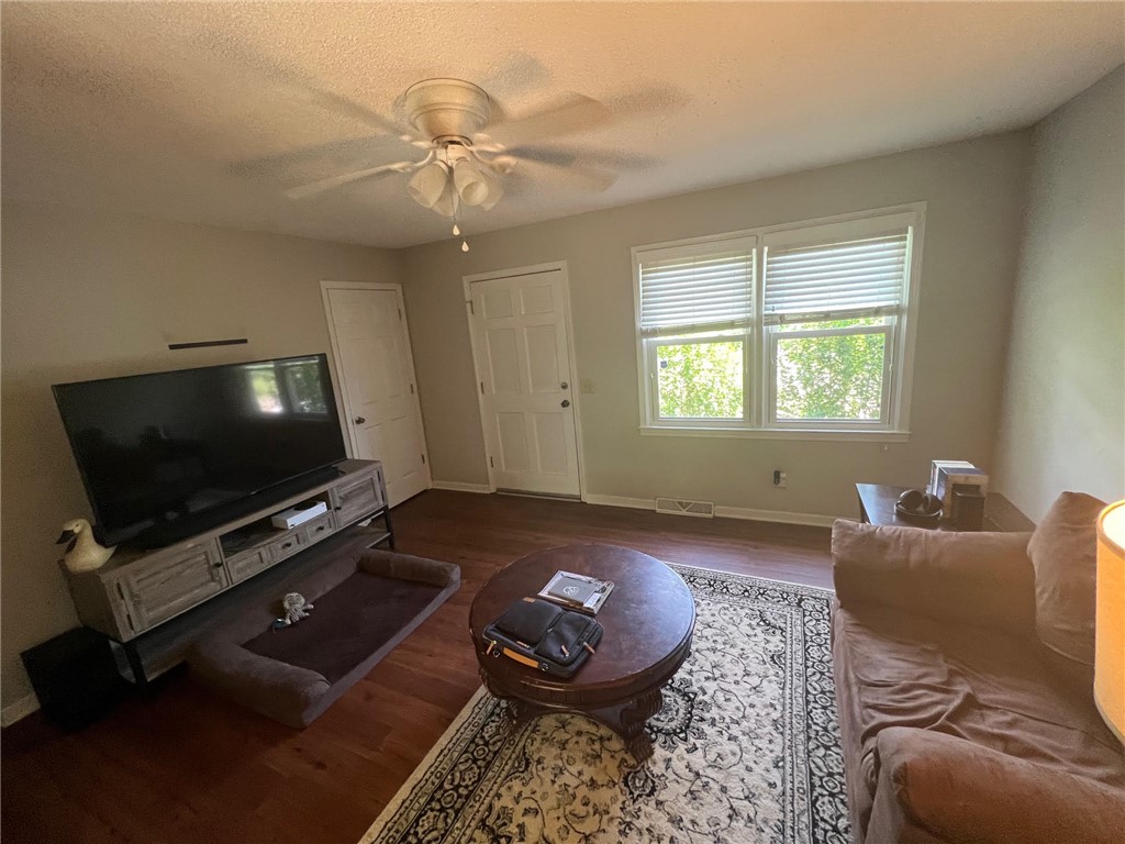 520 Ravenel Circle Seneca, SC 29678 - Photo 3 of 6 Hardwood floors and ample natural light fill this inviting living space, perfect for relaxing.