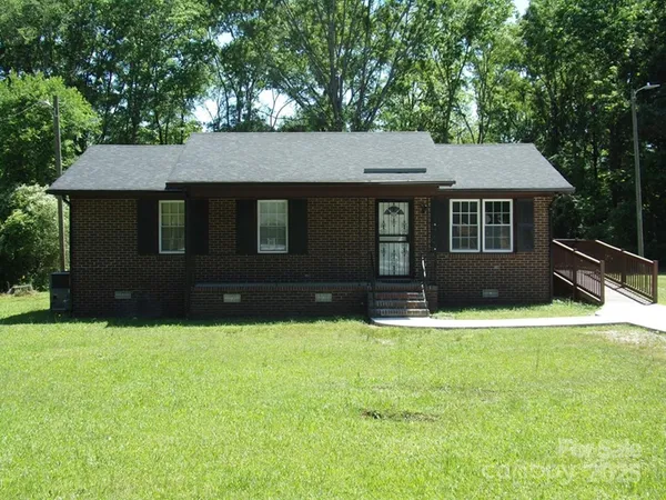 a front view of a house with yard