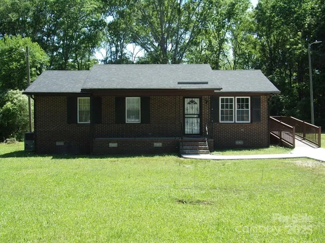 a front view of a house with yard