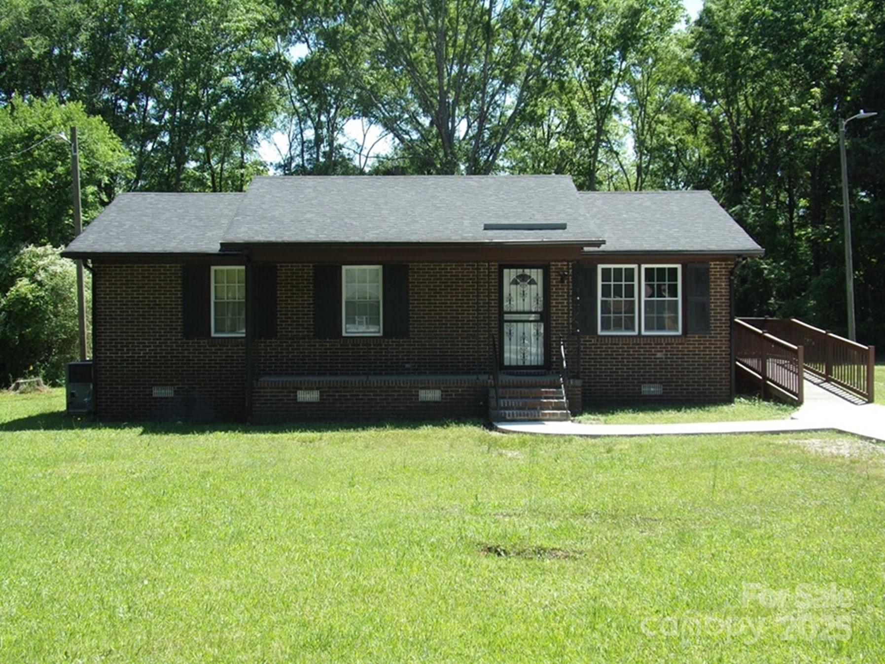 a front view of a house with yard