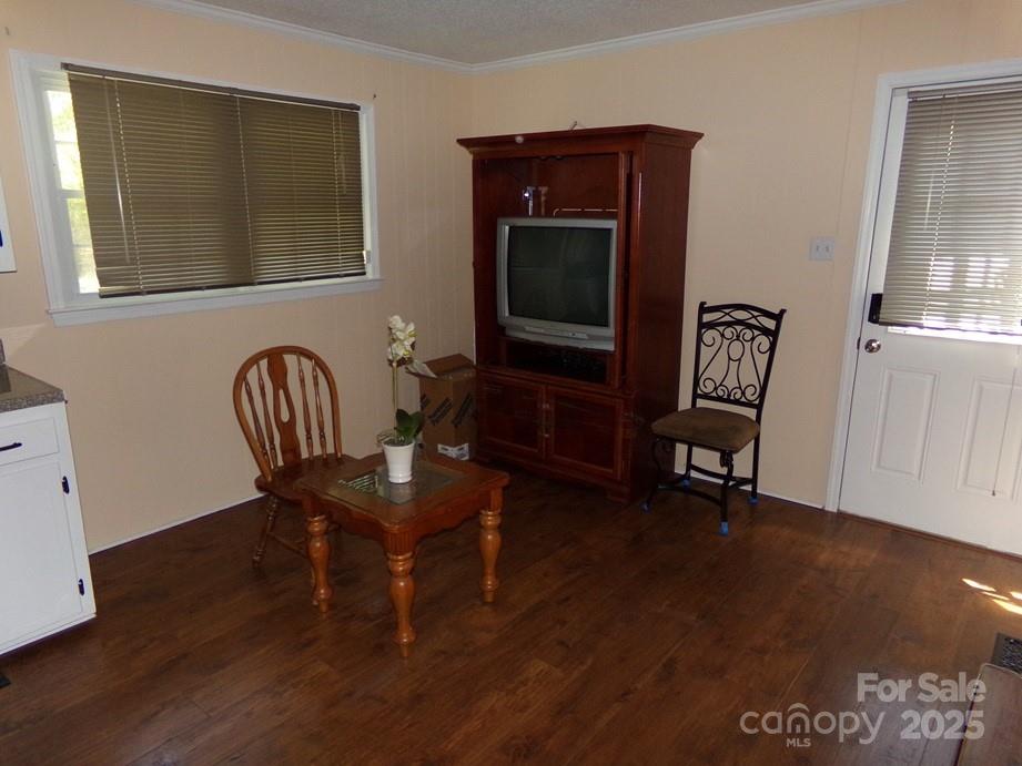 556 Roundtree Circle Chester, SC 29706 - Photo 3 of 15 a view of a workspace with furniture and wooden floor