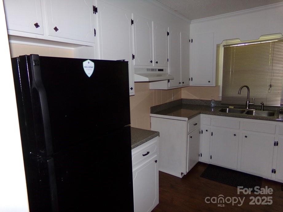 556 Roundtree Circle Chester, SC 29706 - Photo 4 of 15 a kitchen with a sink and cabinets