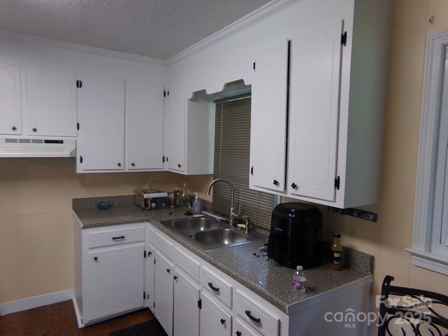 556 Roundtree Circle Chester, SC 29706 - Photo 5 of 15 a kitchen with stainless steel appliances granite countertop a sink a stove and a refrigerator