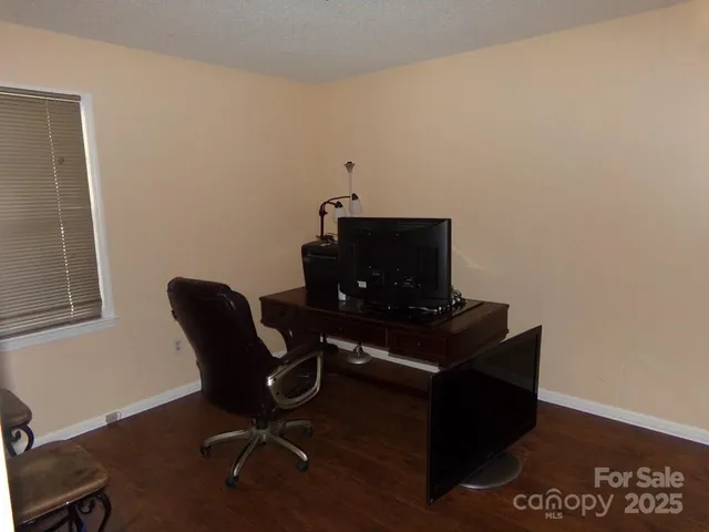 a view of workspace with wooden floor
