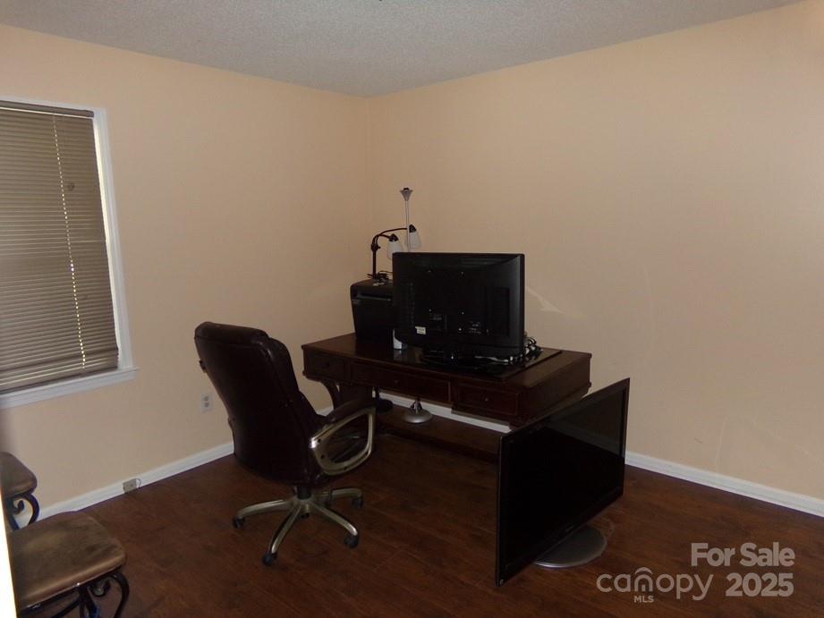 556 Roundtree Circle Chester, SC 29706 - Photo 7 of 15 a view of workspace with wooden floor