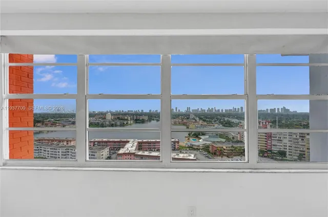 a view of a room that has a large window