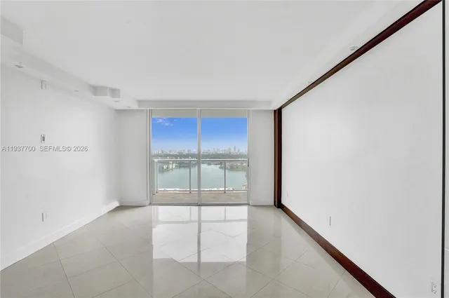 a view of an empty room with a window