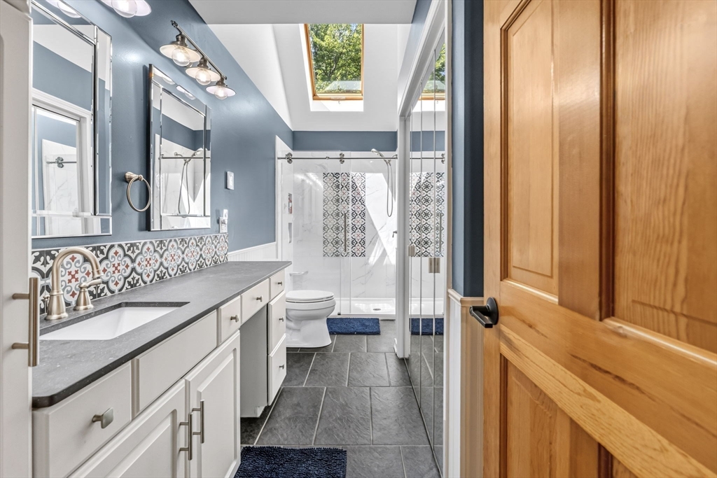 345 Harvey Road Worthington, MA 01098 - Photo 23 of 41 a bathroom with a sink a toilet and a large mirror