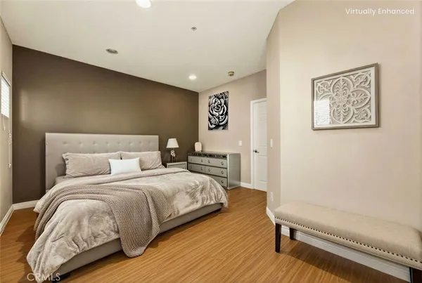 a bedroom with a bed and a couch