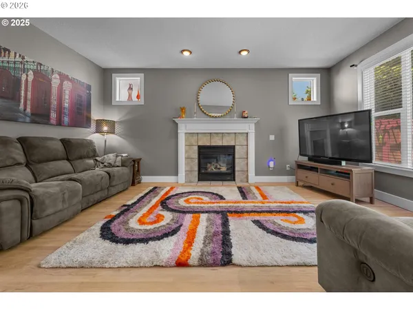 a living room with furniture and a fireplace