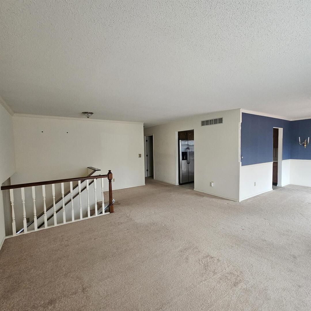4412 Woodglen Lane Mount Vernon, IL 62864 - Photo 12 of 35 a view of an empty room with staircase