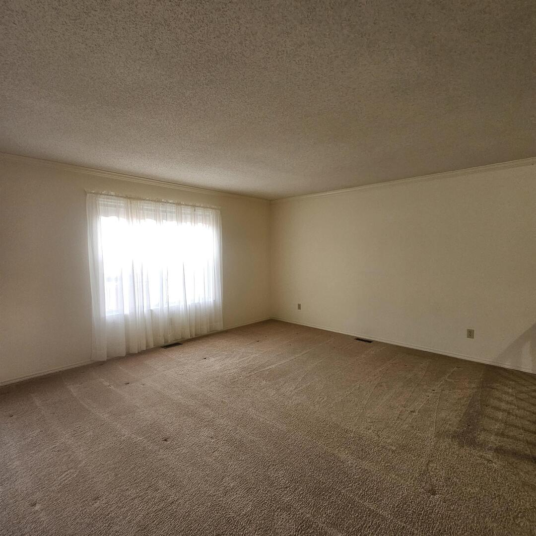4412 Woodglen Lane Mount Vernon, IL 62864 - Photo 15 of 35 an empty room with windows