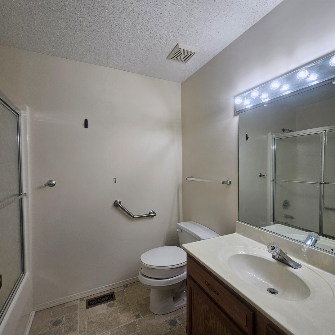 4412 Woodglen Lane Mount Vernon, IL 62864 - Photo 22 of 35 a bathroom with a sink a toilet and shower