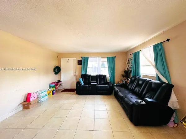 a living room with furniture and a couch