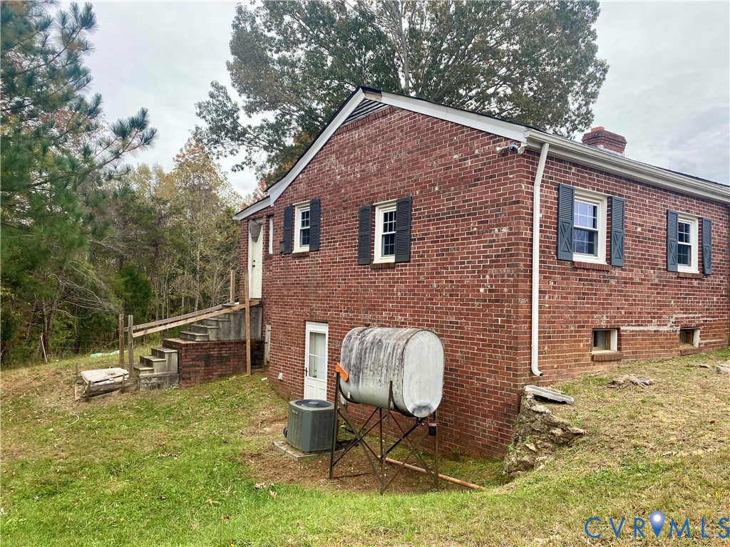 906 Evans Road Powhatan, VA 23139 - Photo 11 of 18 View of home's exterior featuring brick siding, st