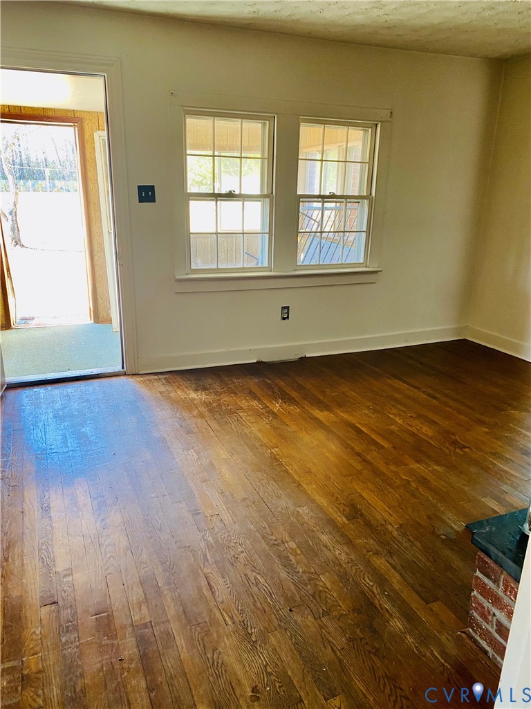 Entrance foyer with dark wood-style flooring