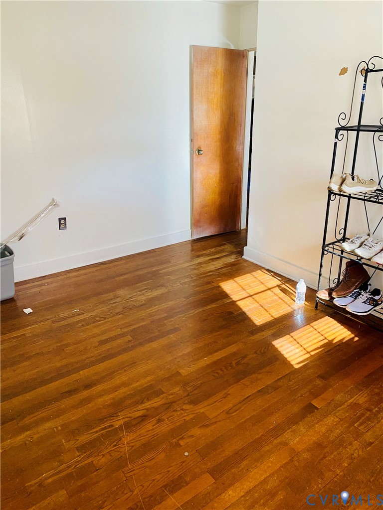 906 Evans Road Powhatan, VA 23139 - Photo 8 of 18 Empty room featuring dark wood-style flooring