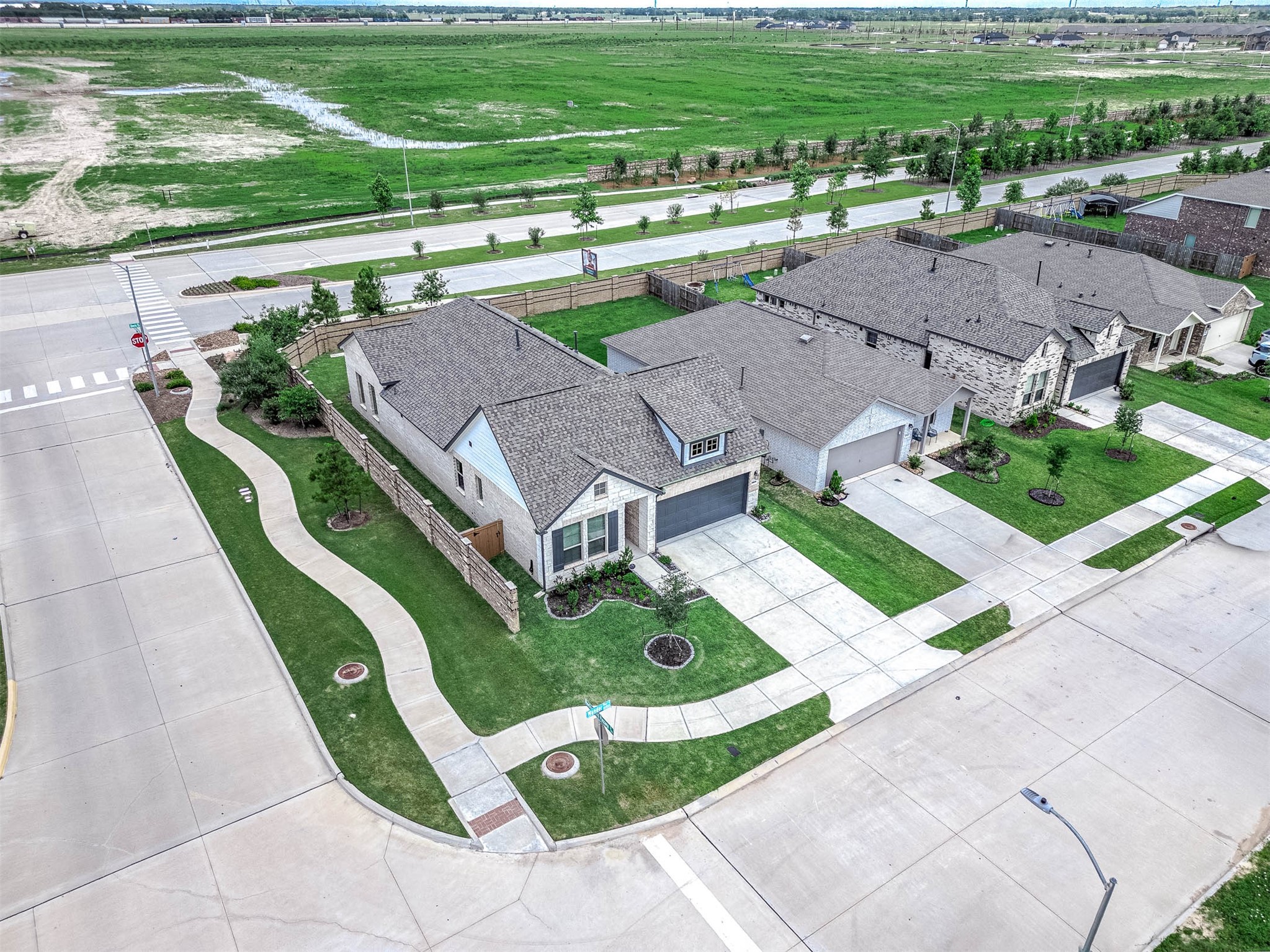 10926 Wander Way Beasley, TX 77417 - Photo 29 of 38 an aerial view of a house with a garden and swimming pool