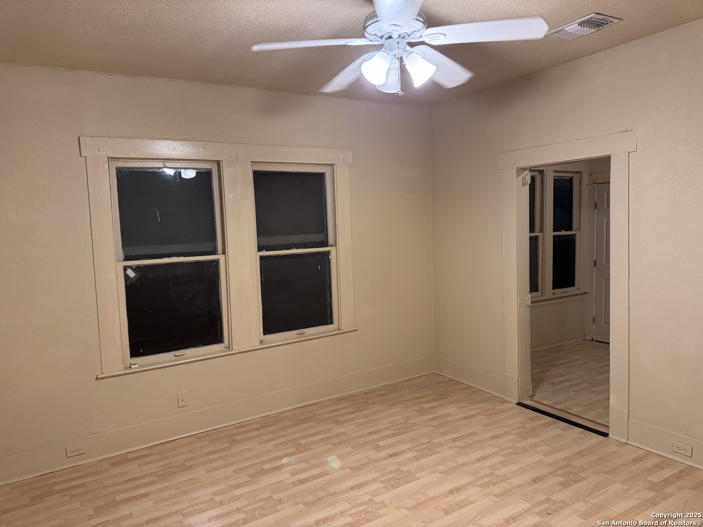 211 Blanco Road San Antonio, TX 78212 - Photo 16 of 34 an empty room with wooden floor closet and windows